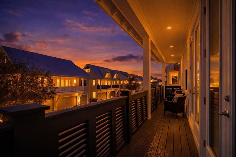 Large private balcony spans across the front of the home.