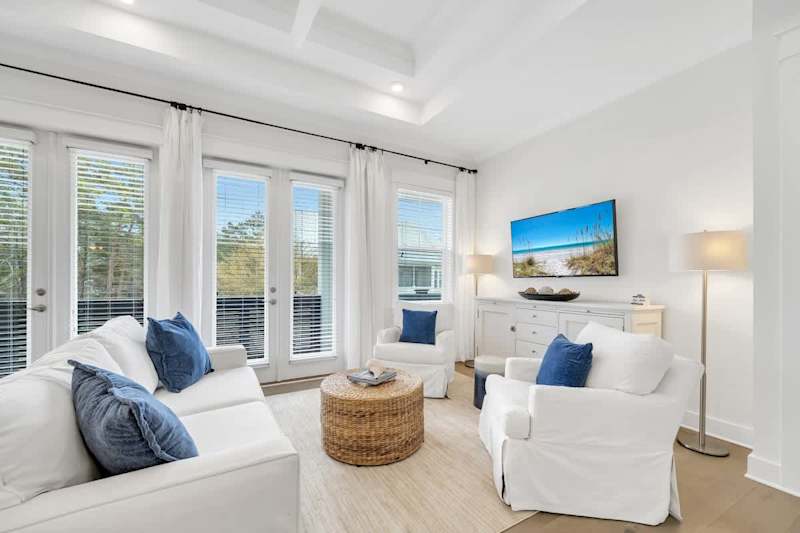 Living room features direct access to private balcony.