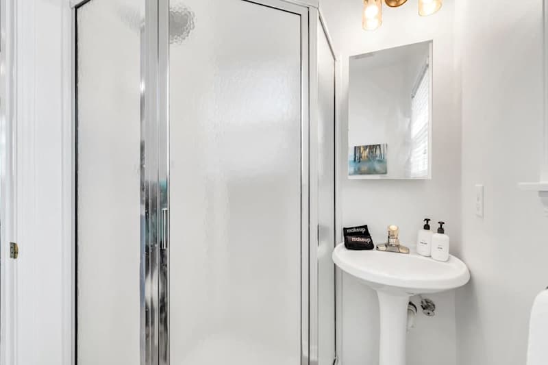 Second floor hall bathroom features walk-in shower