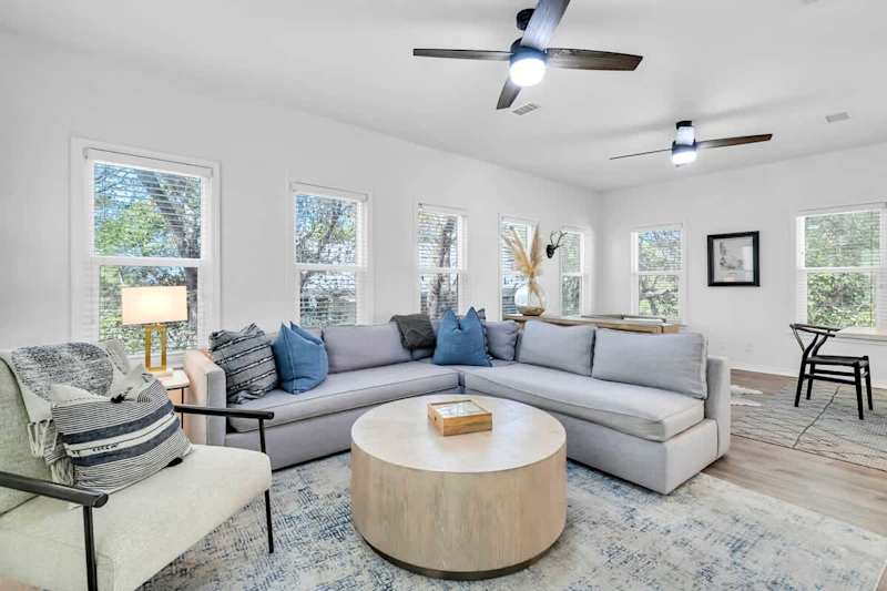 Living room features seating for all and smart tv,