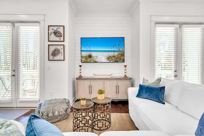 Living room space has a smart tv and plenty of seating for the family!