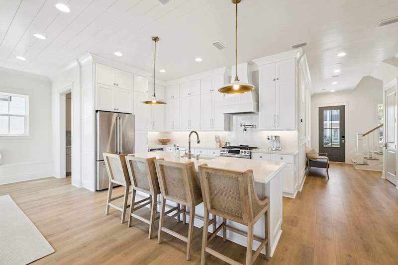 Meals made easier with the fully stocked kitchen with large island + seating for 4