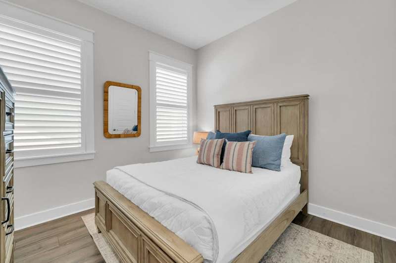 Bedroom #1 features a queen bed and smart tv.