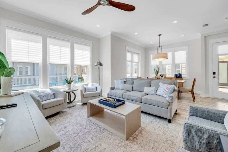 Plenty of seating in the living room space for the family.