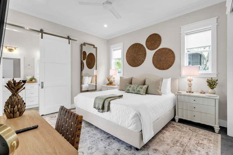 The Master Bedroom Features a King with Ensuite walk-in shower, Smart Tv, & Work Space