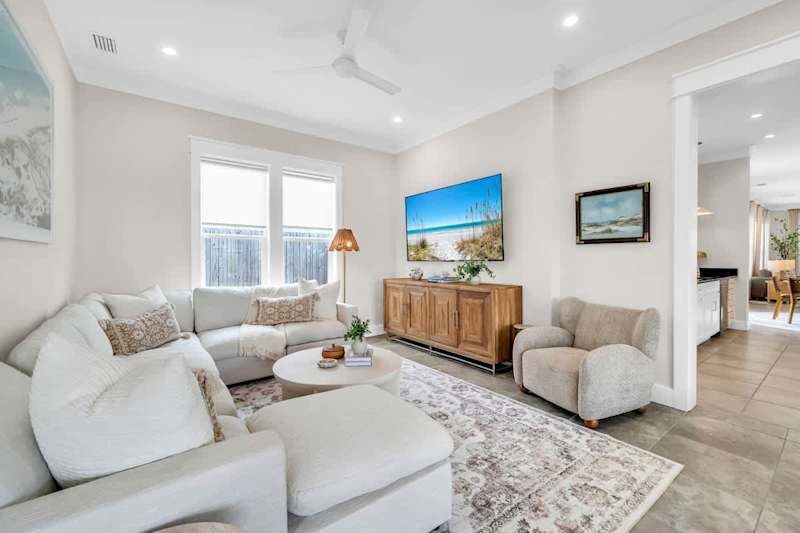 Second living room off the kitchen with seating and smart tv