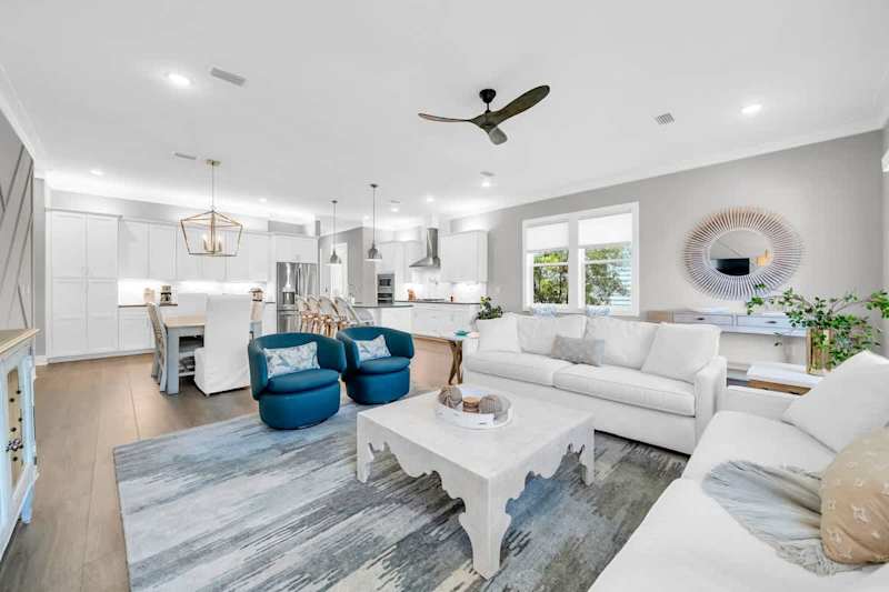 Open concept main floor living space with smart tv