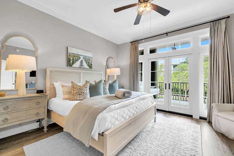 Master bedroom features a king, with ensuite, smart tv, and porch access