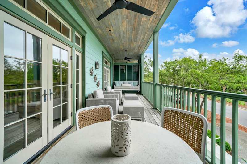 Private porch features outdoor seating perfect for morning coffee or sunset evenings!