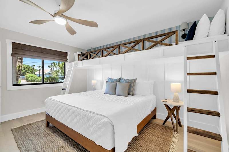 Guest bedroom features built-in overhead twin beds 
