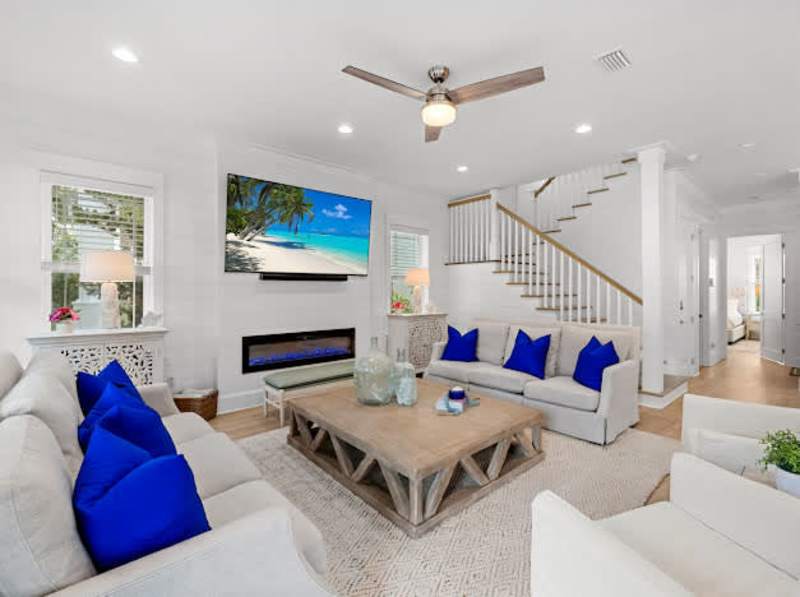 Living room features an 85" TV with Sonos sound system and subwoofer. Perfect for movie night!