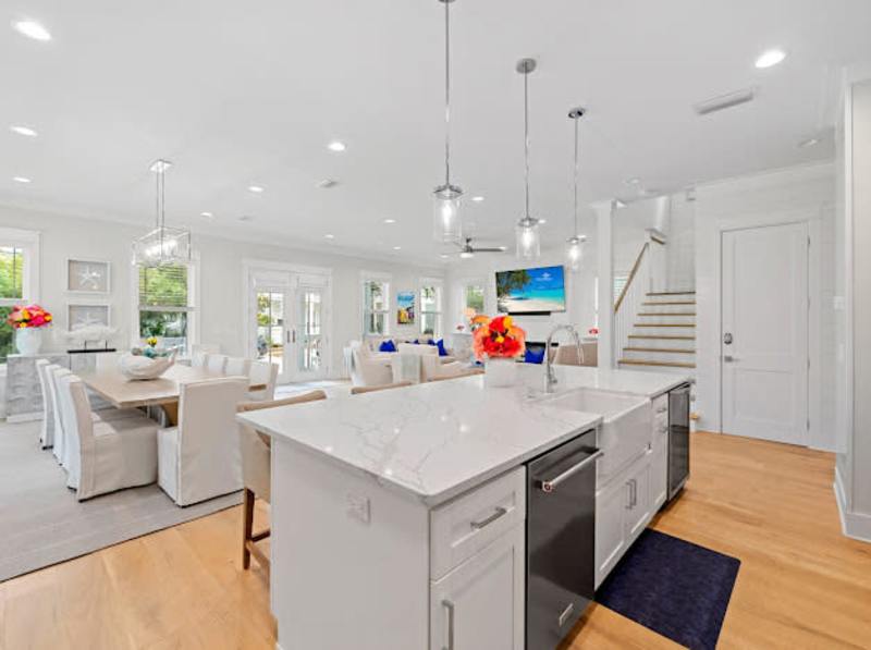 Large kitchen island includes seating for an additional four.
