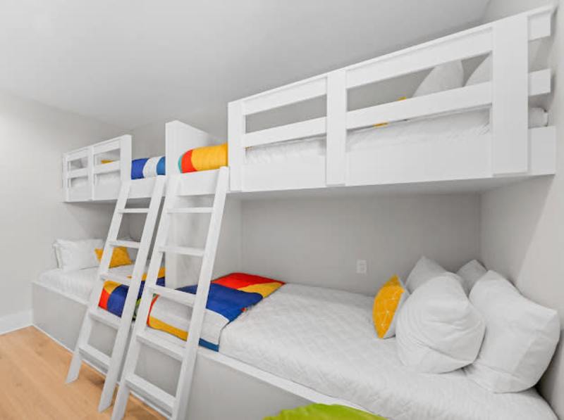 Bedroom #4 features custom built bunk beds. Two twin over full bunks and a smart tv makes this bedroom the perfect spot for the kiddos in the family!