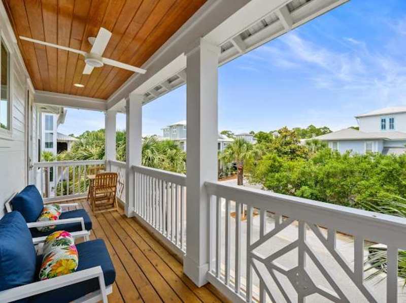 Large covered balcony off bedroom #2 and #3 is the perfect spot to enjoy a morning cup of coffee.