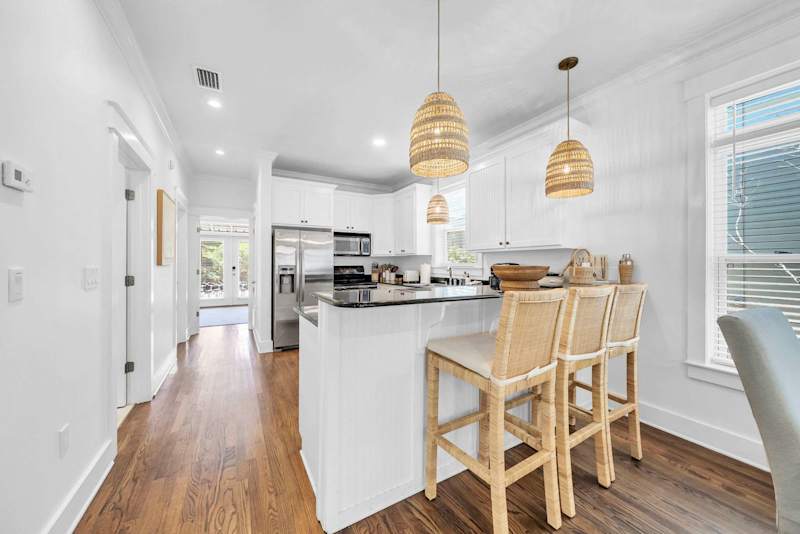 Fully stocked kitchen with island seating for 3