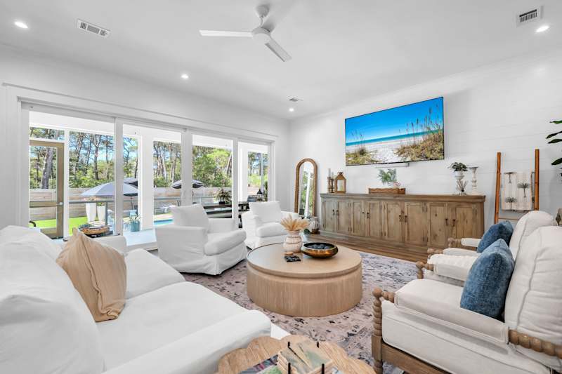 Living room features seating for all and smart tv