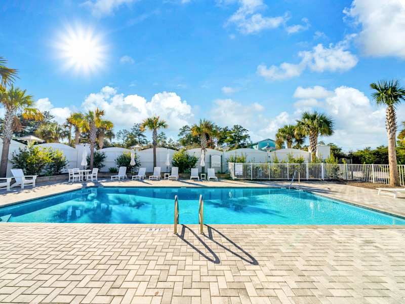Community pool with lounge chairs