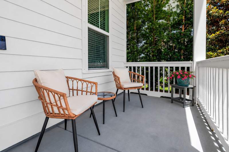 Private front porch with seating, perfect for morning coffee!