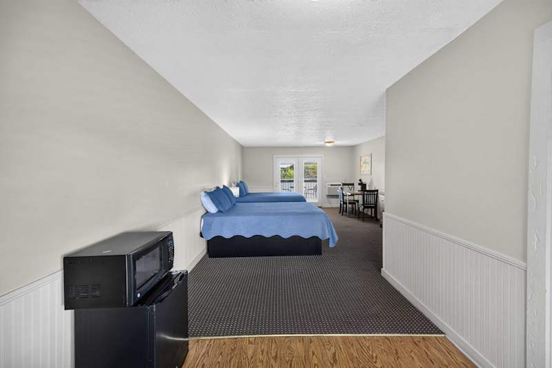 Entrance to your unit with a mini fridge and microwave