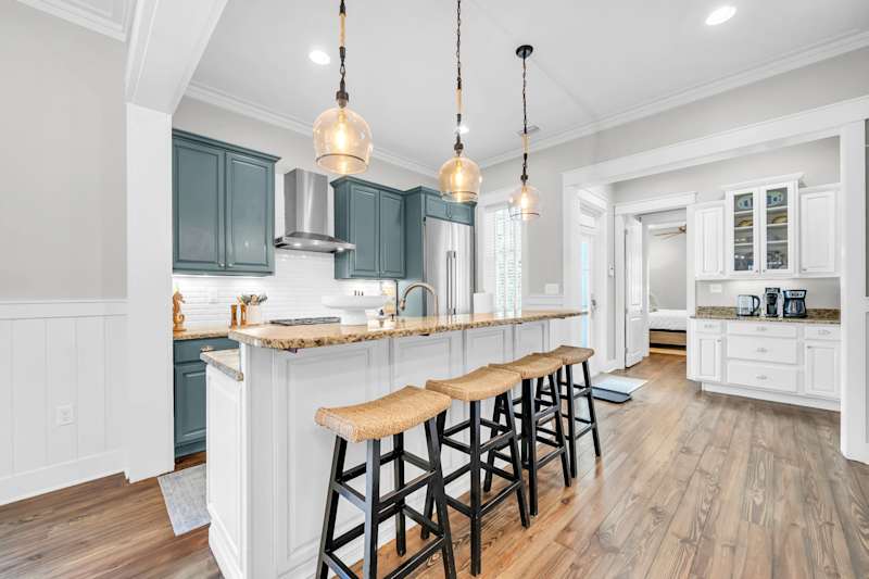 Fully stocked kitchen with island seating for four