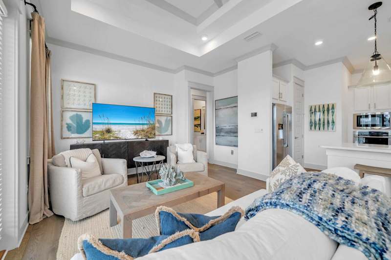 Living room features a sleeper sofa and smart tv