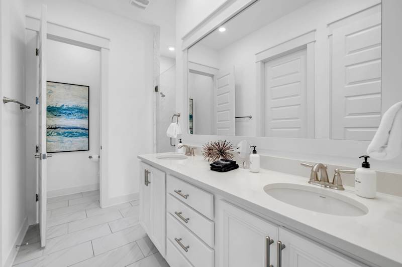 Master bedroom ensuite features dual vanities & walk-in shower