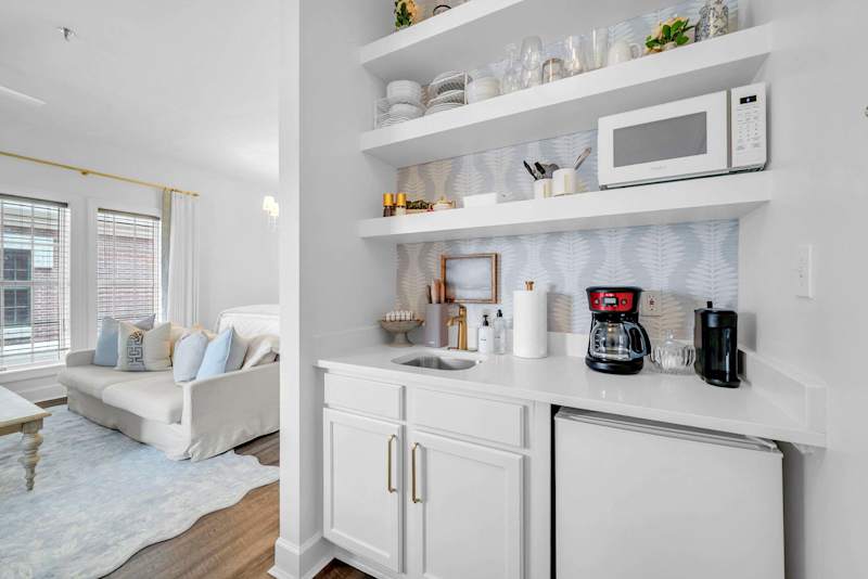 Kitchenette in condo features a Keurig/Drip coffee maker, mini fridge/freezer, and dishes!