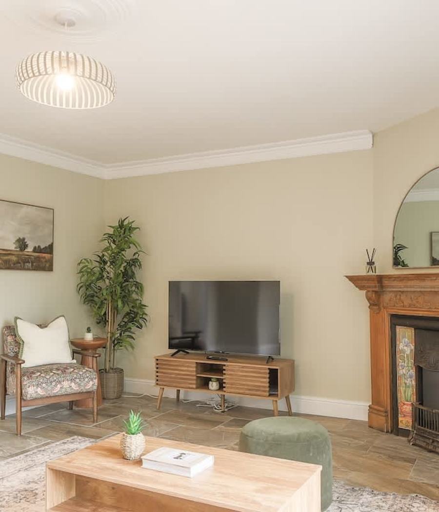 Living room with a fireplace in one of our Swansea homes
