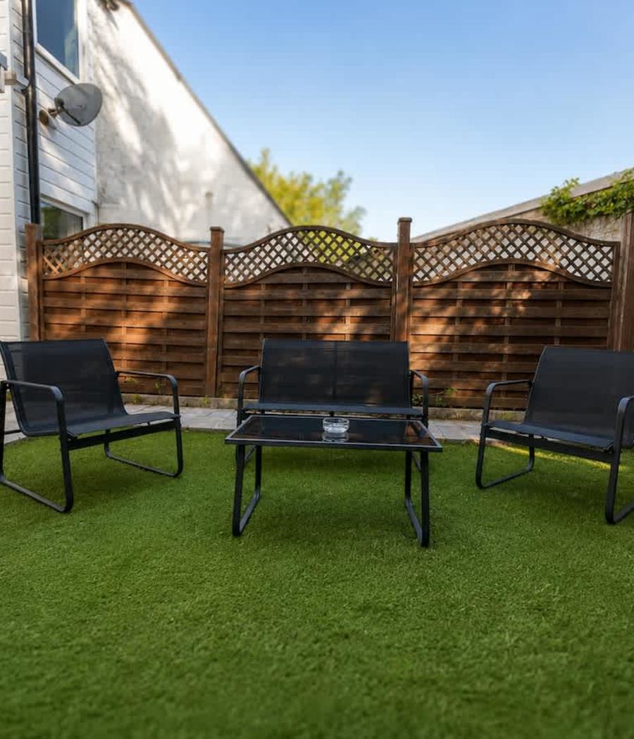 The back garden with outdoor seating at our Windsor house