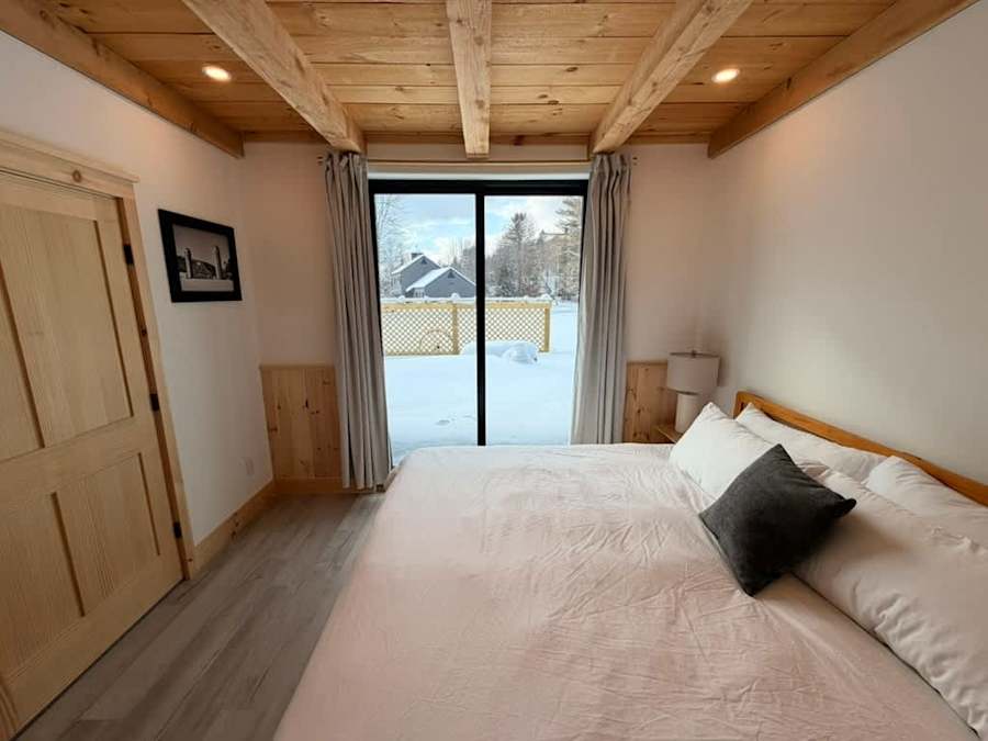 Bedroom 1, with a queen bed and a closet.
