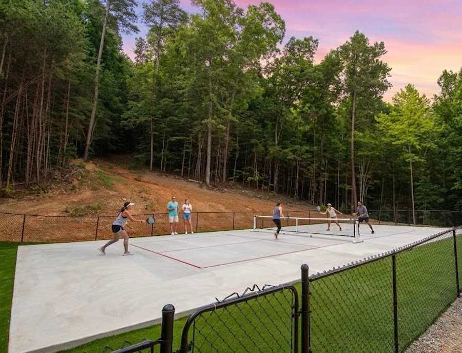 The communal pickleball court is a short drive from Treetop Escapes