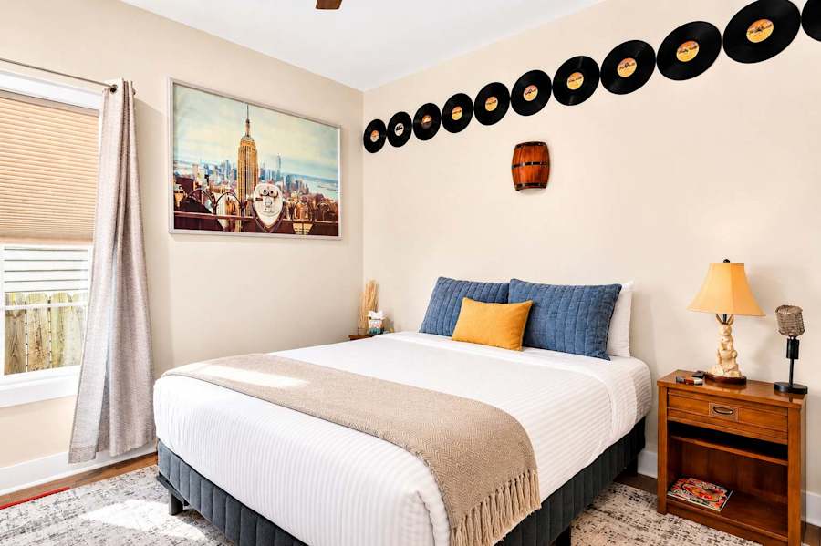 Bedroom 1, with a queen bed and plush bedding.