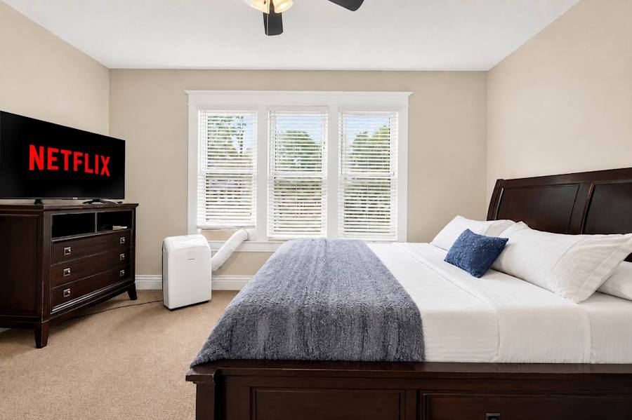 Bedroom 1, with a king bed and a dresser.