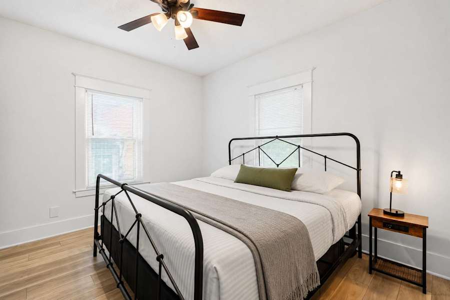 Bedroom 4, with a queen bed and a dresser.