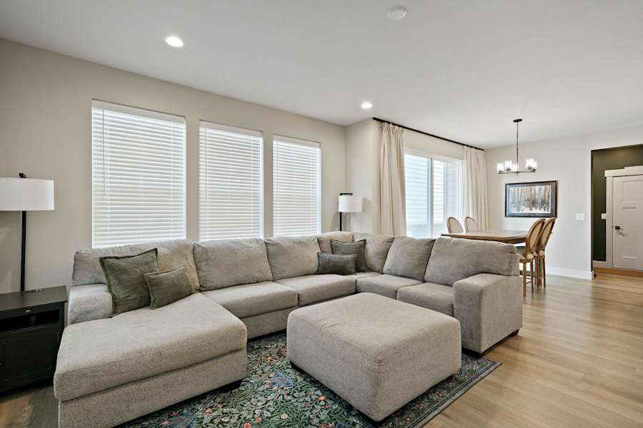 The living room, with plush seating and soft lighting.