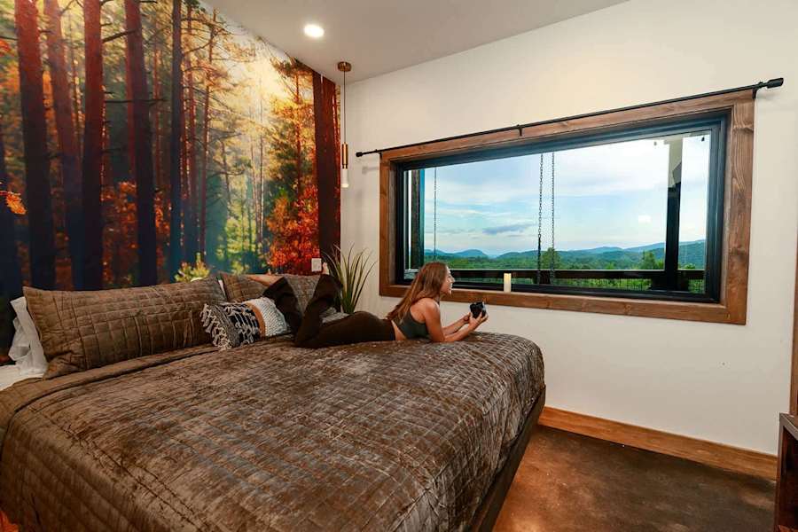 In our downstairs bedroom, you will still find amazing views, luxury linens, & a plush mattress that is unforgettable!