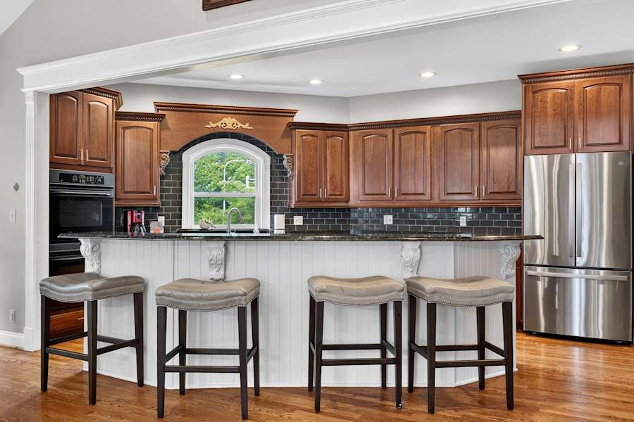 The kitchen has a stove, oven, dishwasher and drip coffee maker.