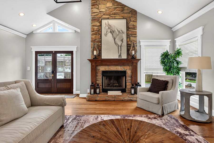 The living room has a Smart TV and a fireplace.