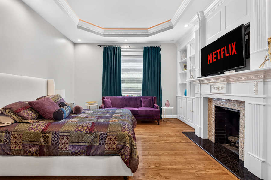 Bedroom 2 has a king bed, a Smart TV and a fireplace.