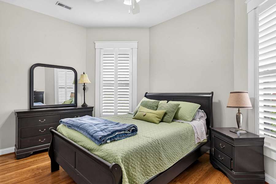 A bedroom with plush bedding and a relaxing atmosphere.