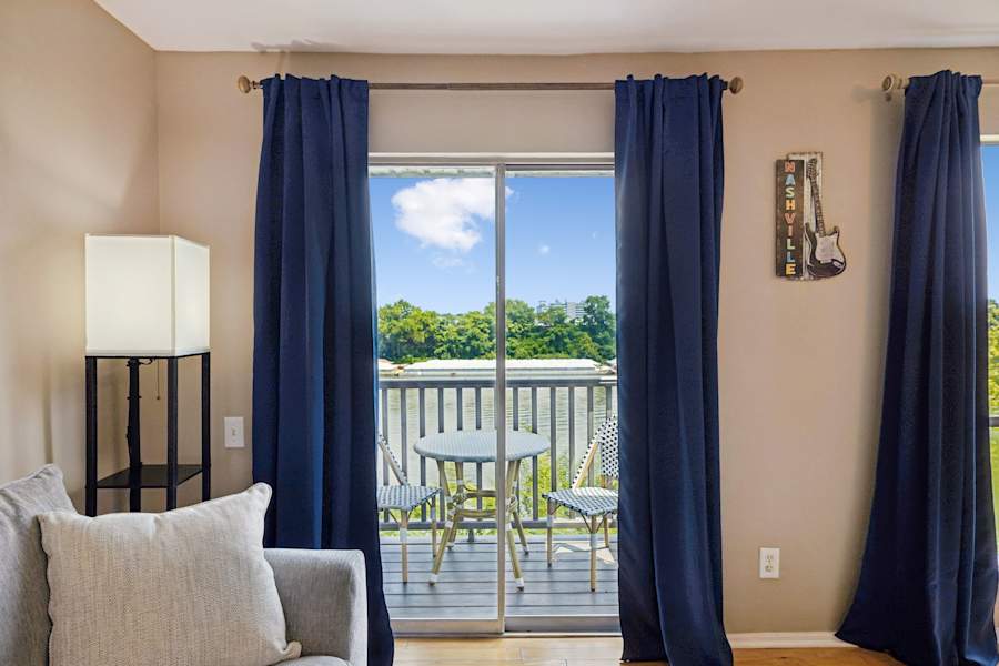 The living room, which overlooks the river and has comfortable furnishings.