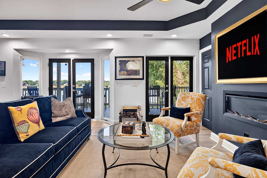 The living room, with comfortable seating and water views.