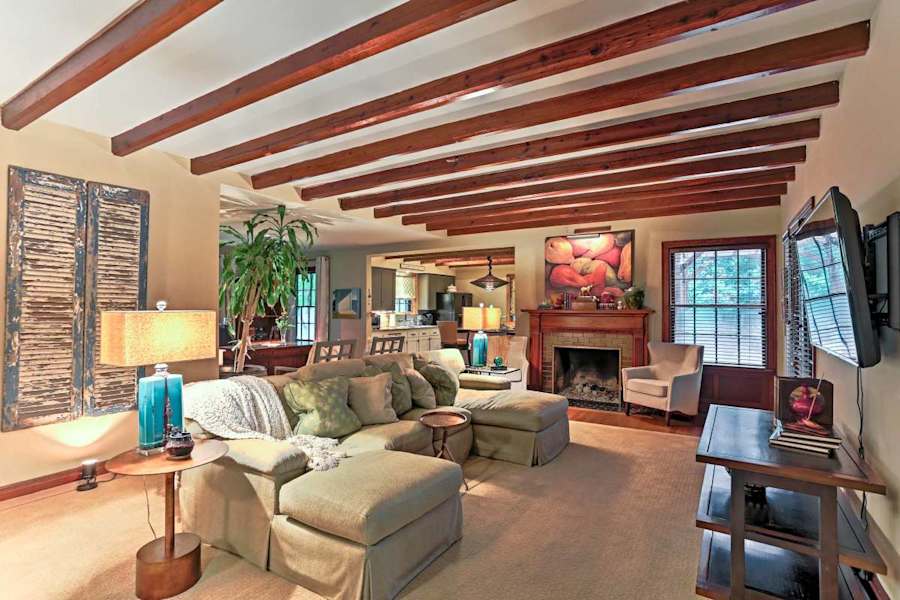 The living room, with comfortable seating and a warm feel.