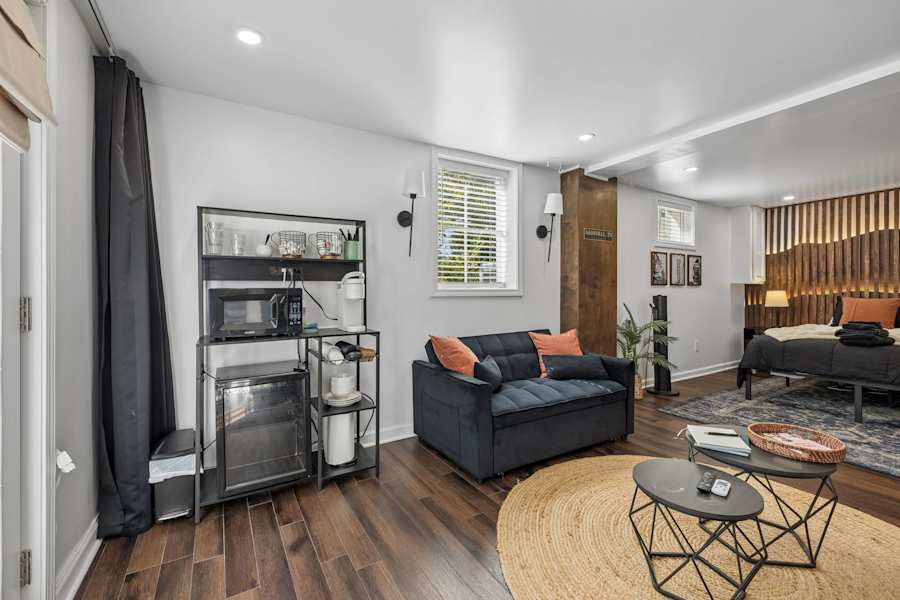 The living room, with comfortable seating for an evening in.