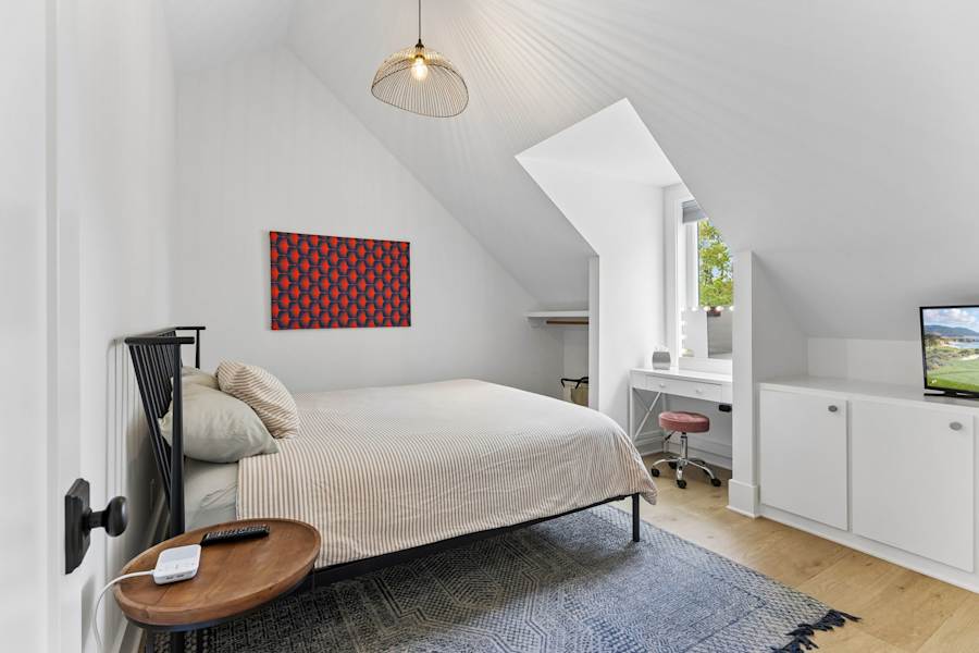 The bedroom, with a king bed and a Samsung smart TV.