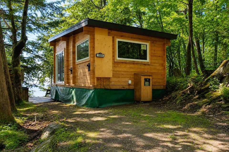 1-Bedroom Unique Eco Log Cabin #106 at Mill Lake Unique Cabins — photograph 1